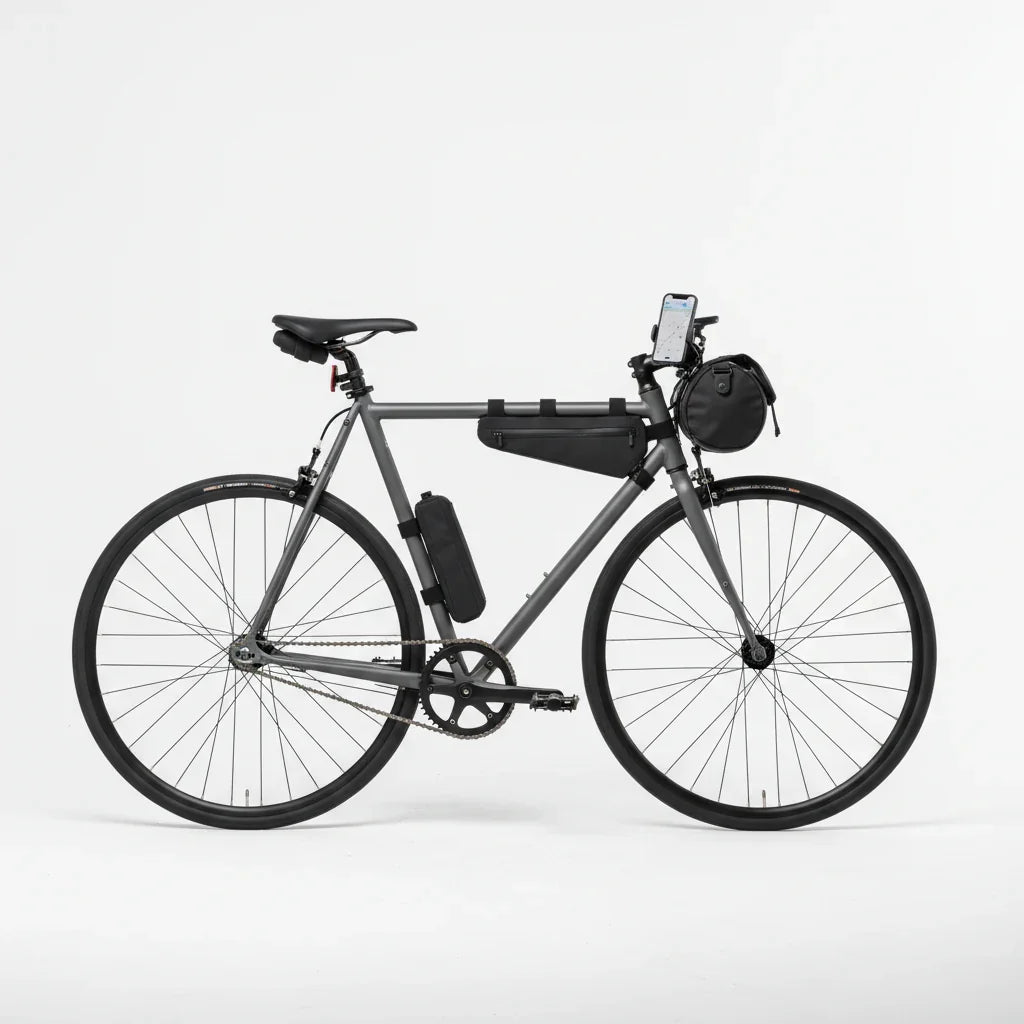 Minimal urban bike with TrekGlow storage accessories and phone mount on white background