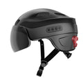 Black smart urban bike helmet with visor, LED rear light, and side controls by TrekGlow