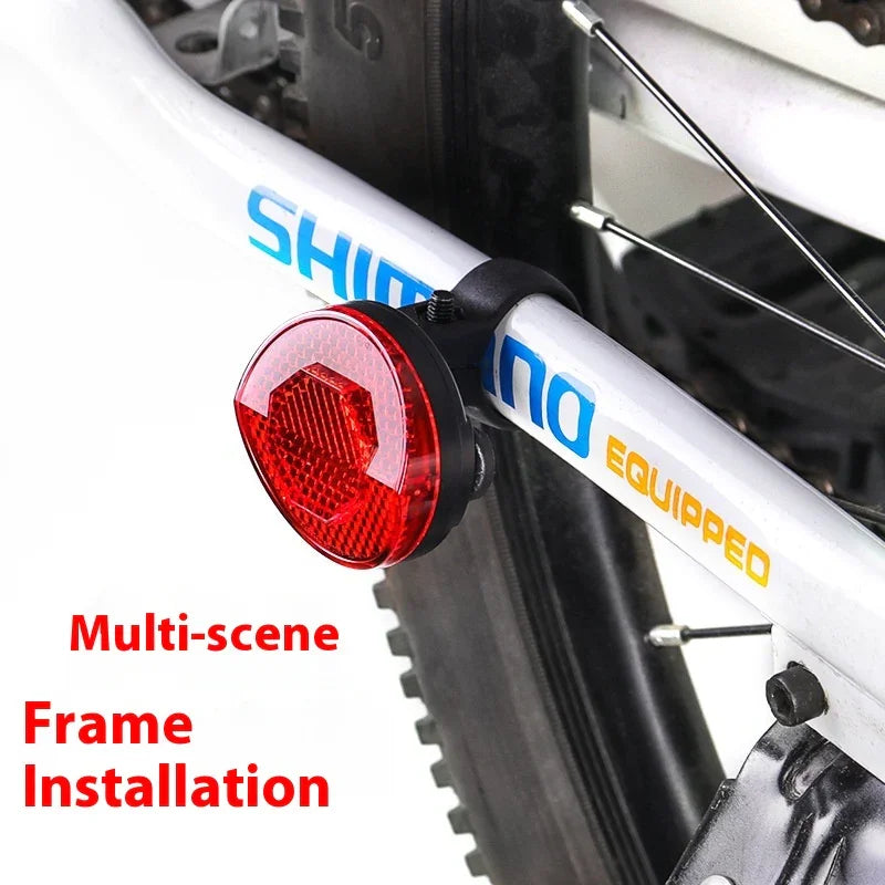 Red bike tail light with reflector on white frame, promotes TrekGlow urban micro-mobility safety.