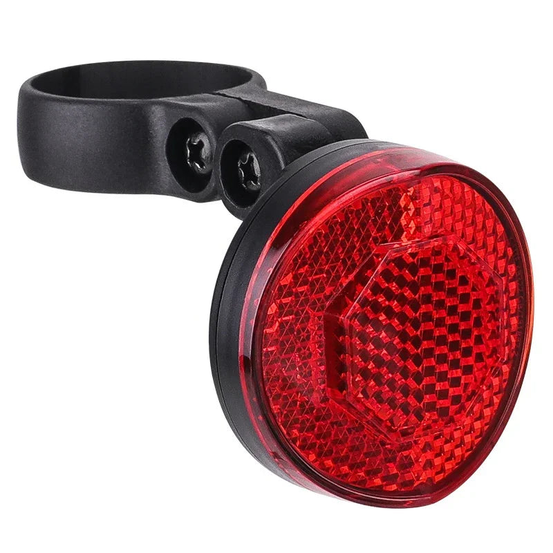 Red rear bicycle reflector with black mounting bracket for urban rider safety by TrekGlow