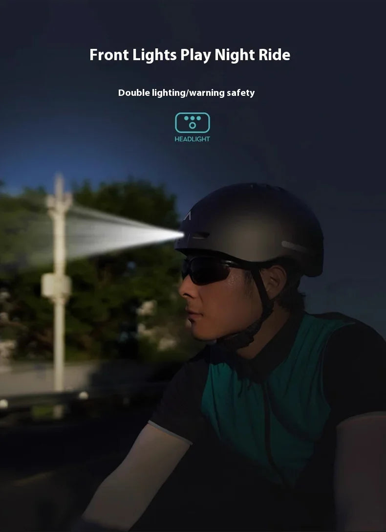Urban cyclist wearing safety helmet with front headlight, riding at night for visibility